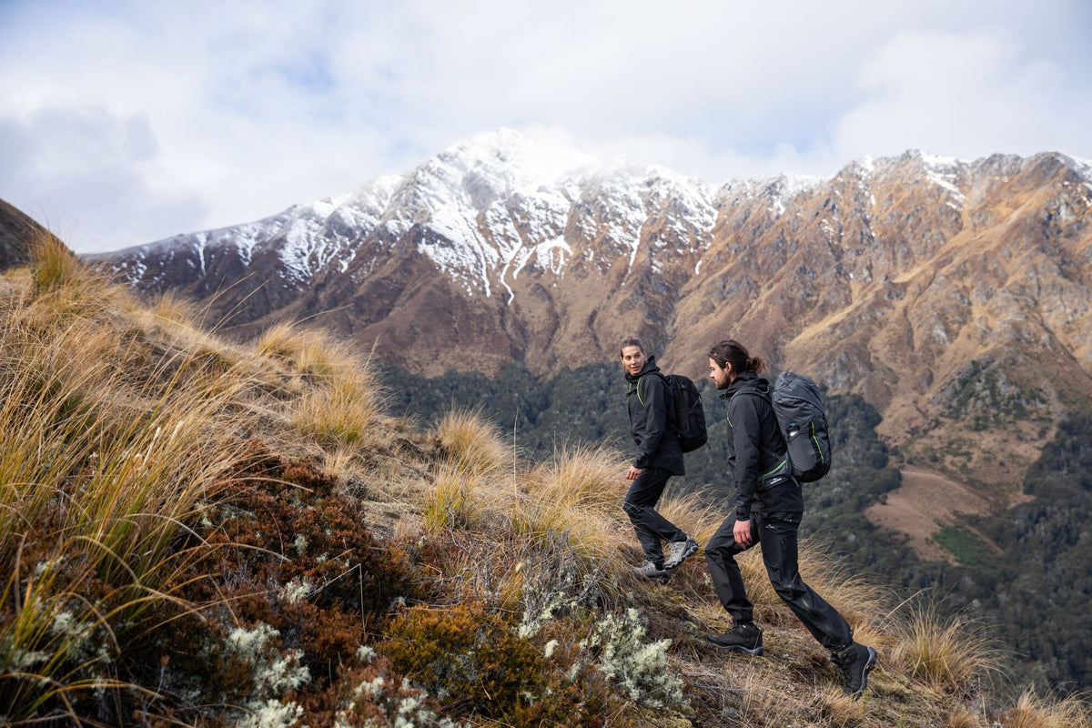 Two hikers walking up a mountain