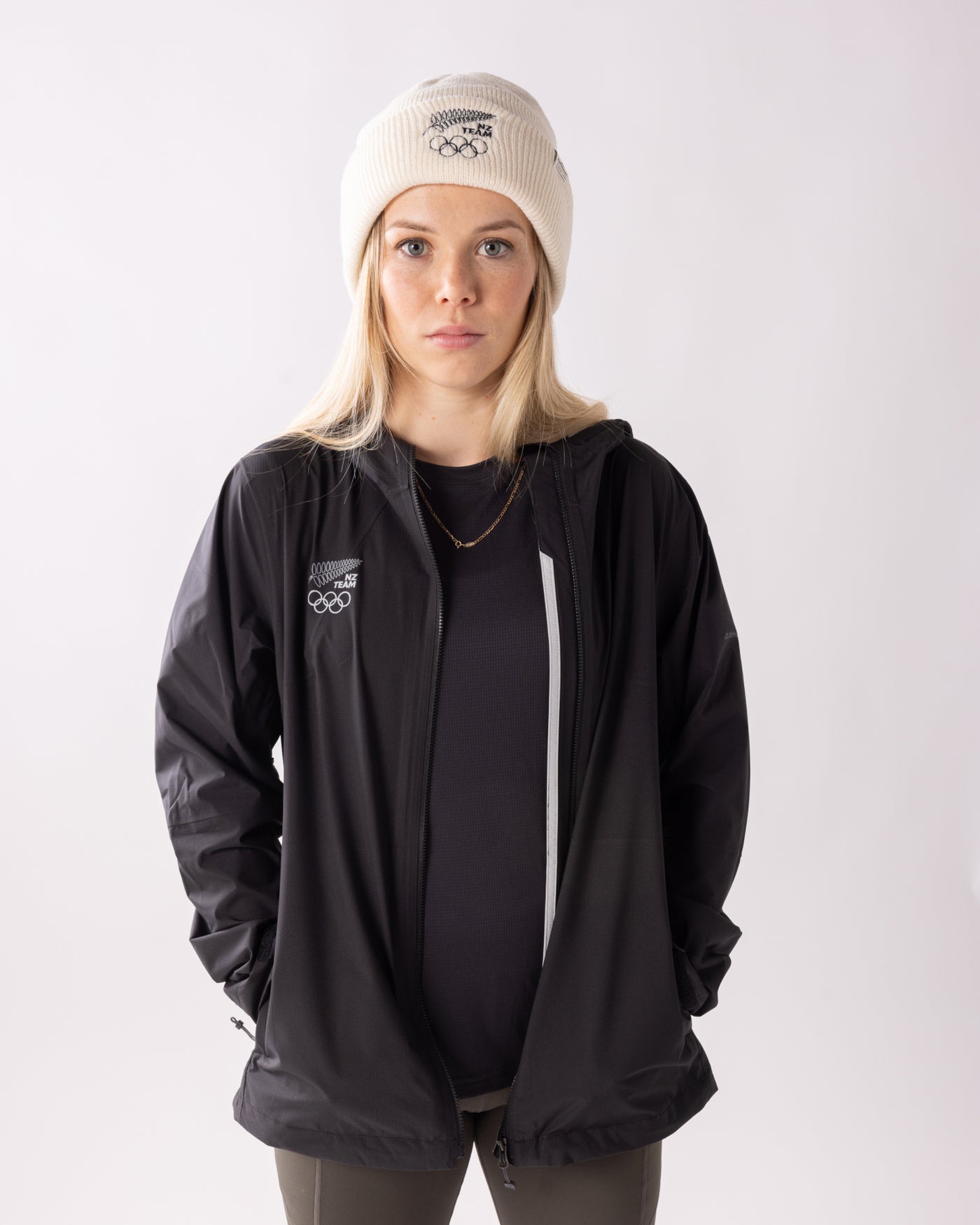 B2308_OZ7_NZOC_Range_Wmns_Trailhead_Stretch_Rain_Jacket_NZ_Team_Black_a_1756683849000