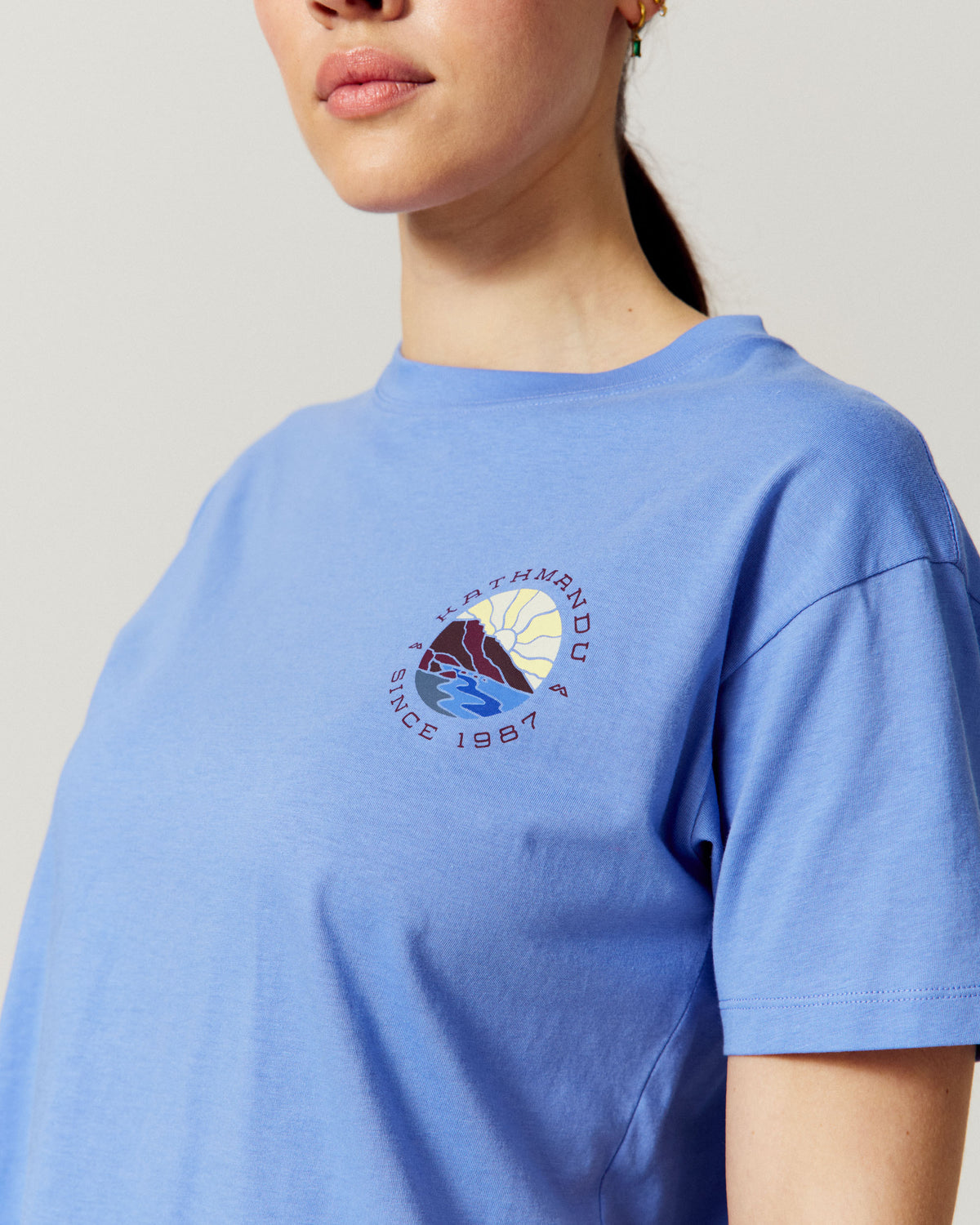 Women's Kathmandu Logo Sunburst Organic Cotton T-shirt - Dew Drop