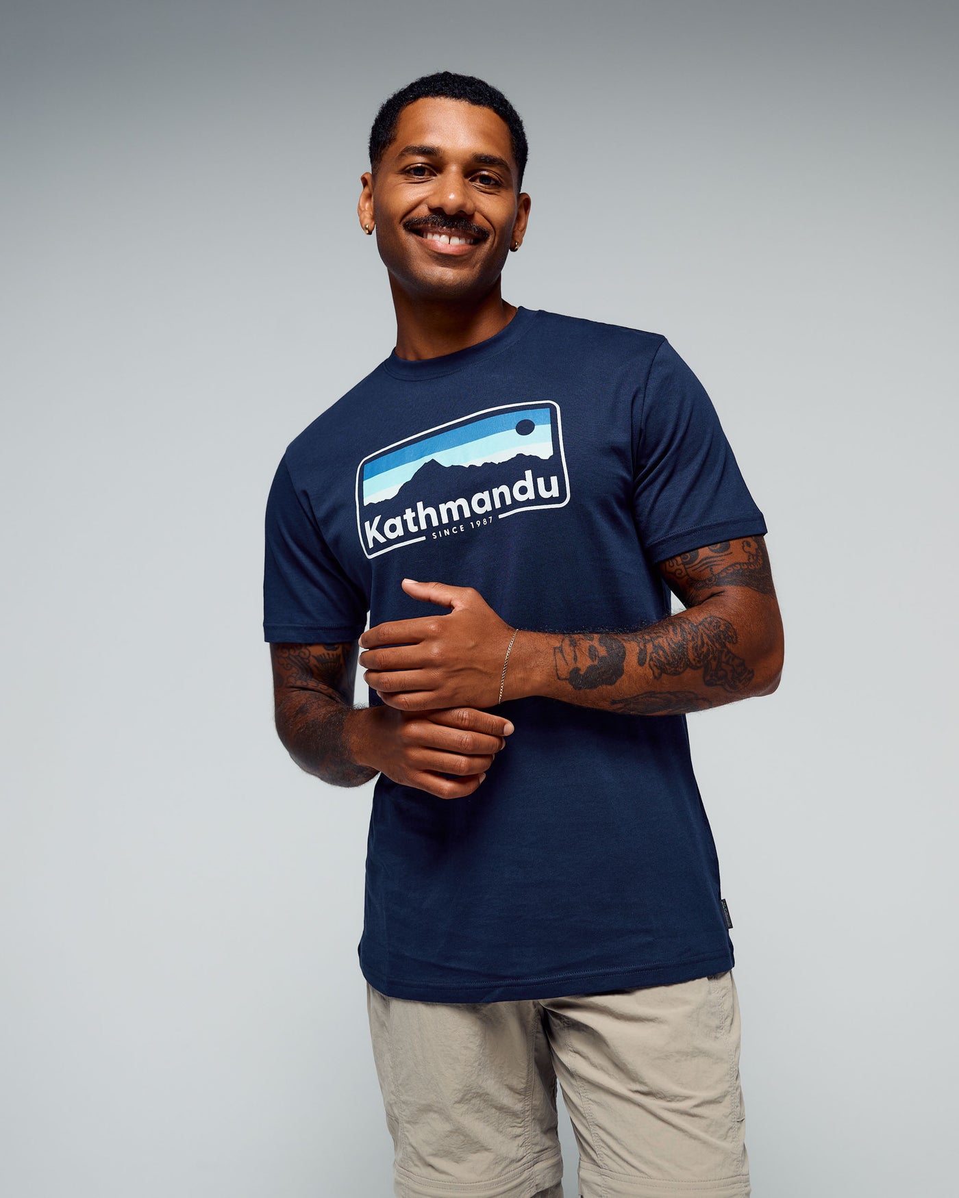 b0995_893_mens_kathmandu_logo_70s_organic_cotton_tshirt_b_1768348924000