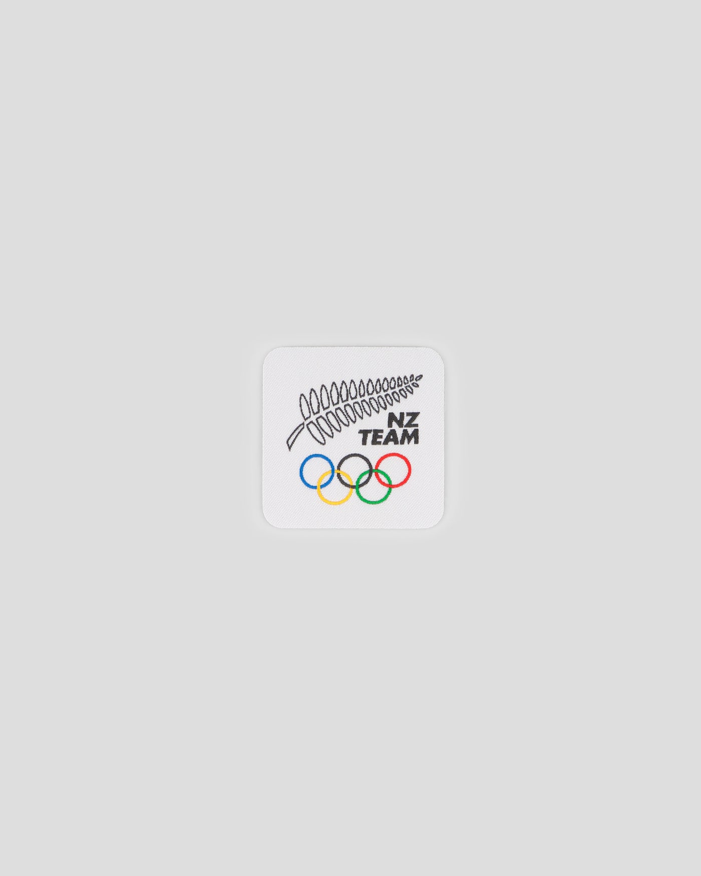 b2175_oyw_nzoc_badge_fern_and_rings_a_1765748396000